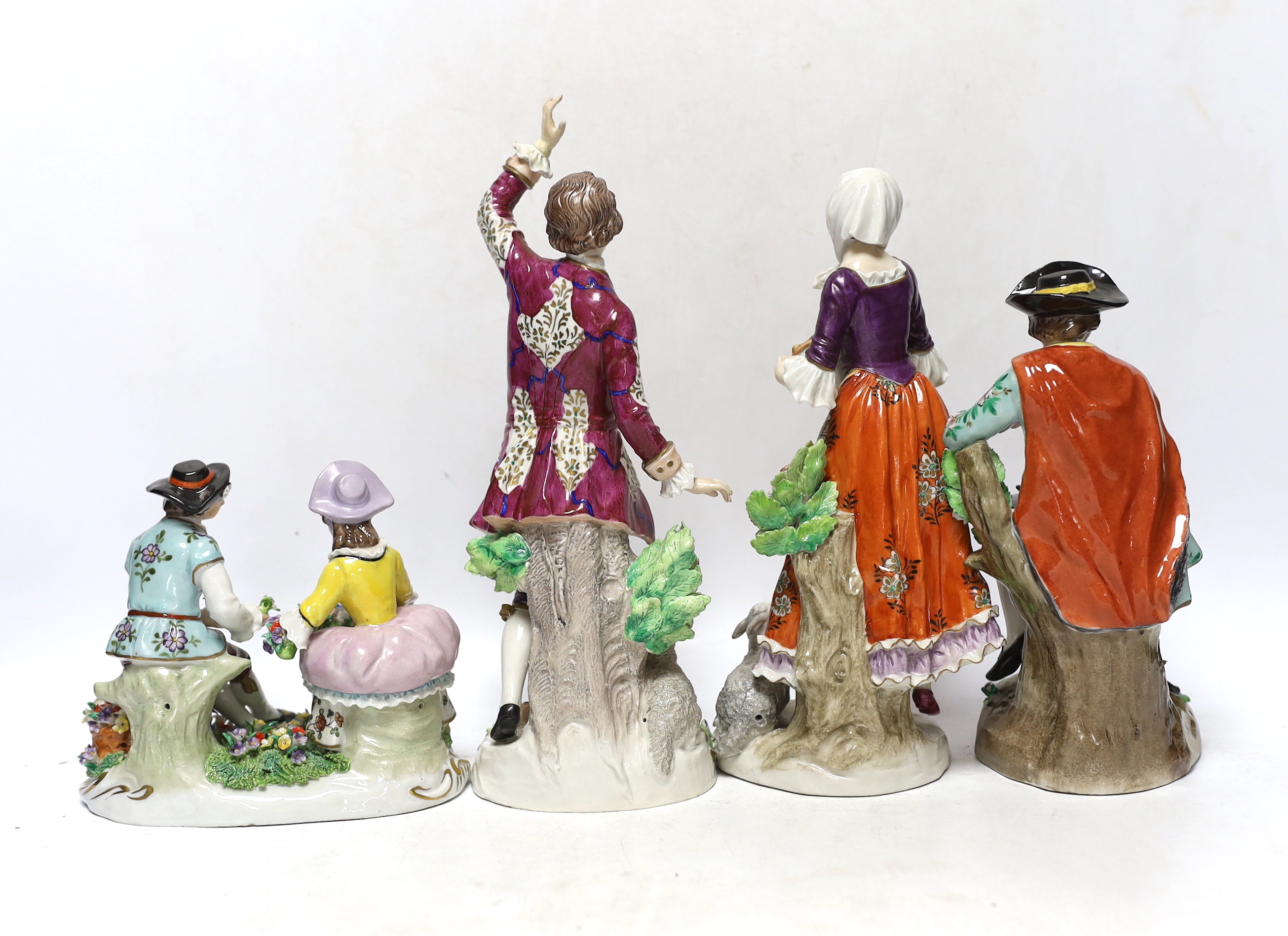 Four Sitzendorf porcelain figures in groups, early 20th century, 26cm